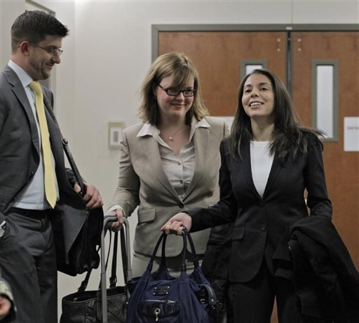 Fox reporter Jana Winter, right, and her attorneys arrive for a hearing for Aurora theater shooting suspect James E. Holmes in Centennial, Colo., where defense attorneys want her to divulge her sources.