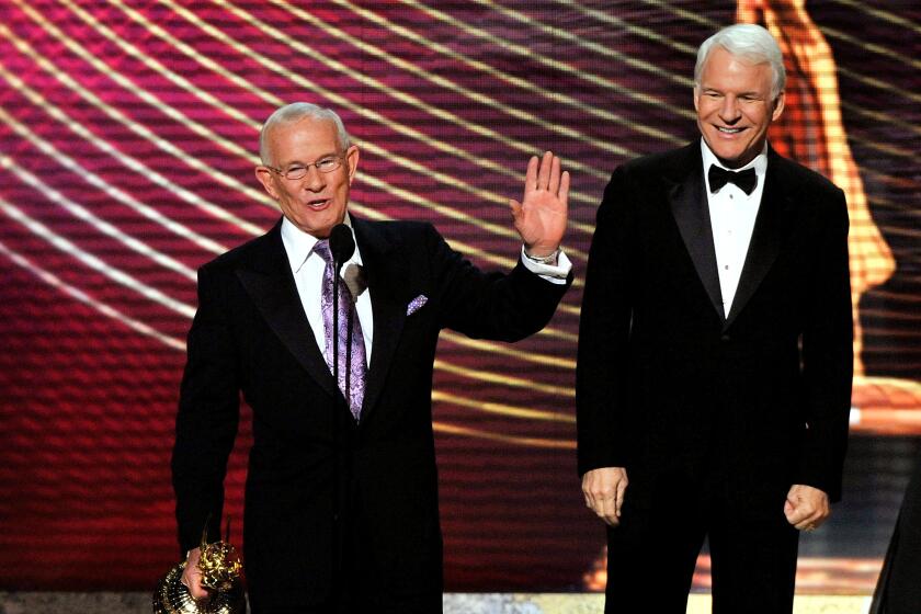 Lommy Smothers, recipient of the Commemorative award and presenter Steve Martin during the 60th Primetime Emmy Awards