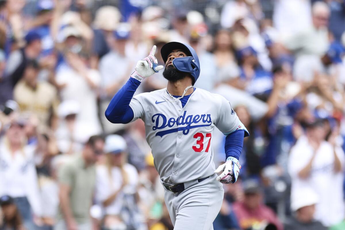 Teoscar Hernández points to the heavens after hitting a three-run homer