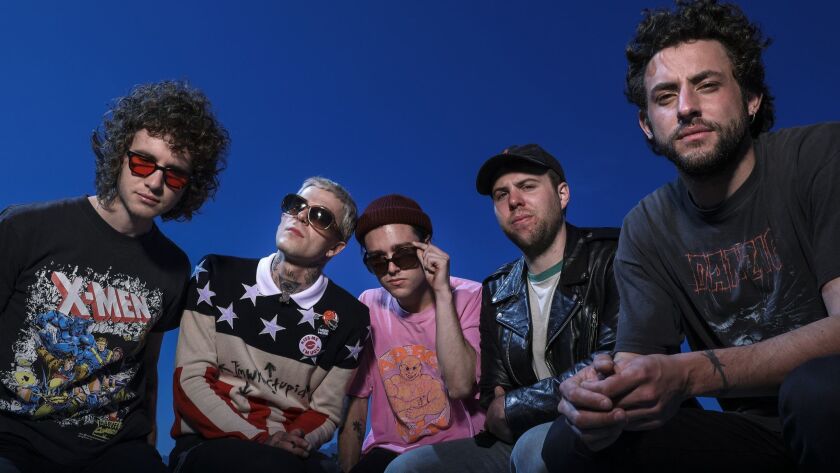 The Neighbourhood, from left: bassist Michael Margott, lead singer Jesse Rutherford, guitarists Zachary Abels and Jeremy Freedman and drummer Brandon Alexander Fried, shown on an L.A. rooftop on March 29.