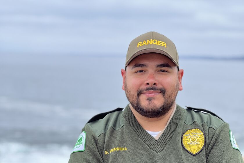 New park ranger aide Gilbert Herrera says he loves talking to people at Point La Jolla.