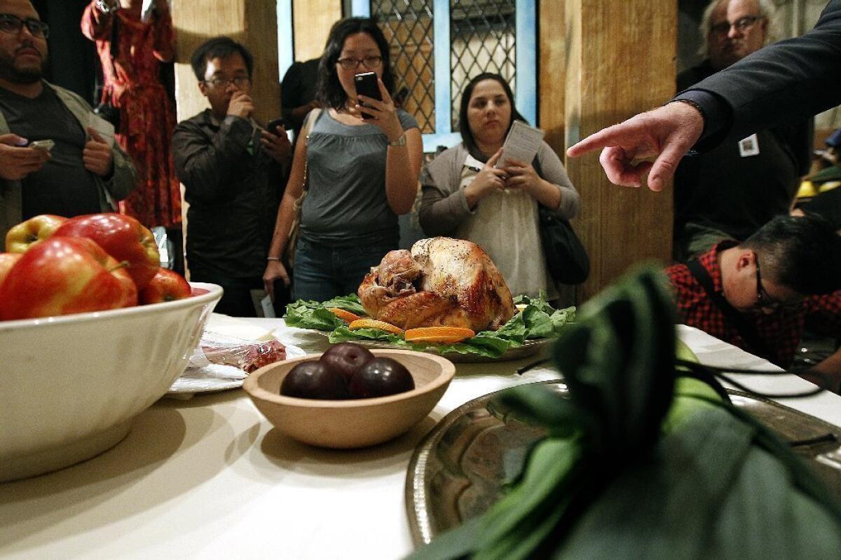 Reporters surround a turkey feast staged backstage at the L.A. Opera before a rehearsal of "Falstaff" at the Dorothy Chandler Pavilion in downtown Los Angeles.