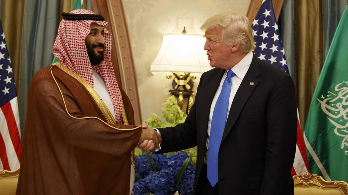 President Trump shakes hands with Saudi Deputy Crown Prince Mohammed bin Salman in a file photo. The administration has actively courted close ties with Saudi Arabia.