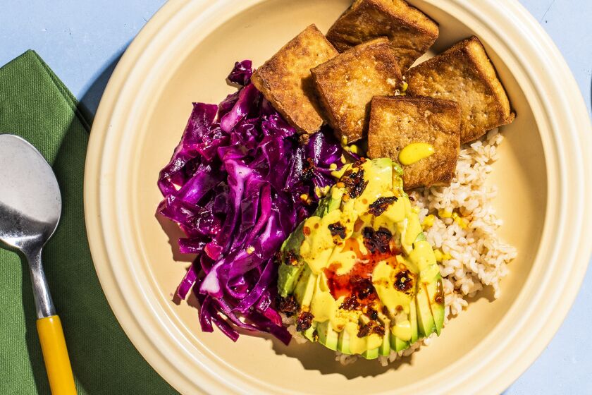 A photograph of Tofu bowls with lemon-lime cabbage, avocado and turmeric tahini by Dawn Perry for the Los Angeles Times Week of Meals.