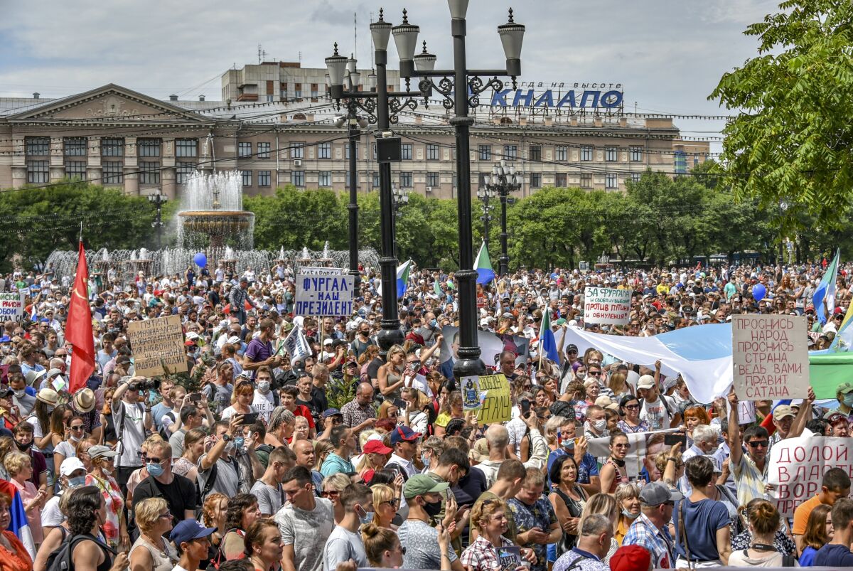 People attend a rally in Khabarovsk in support of the region's governor Sergei Furgal