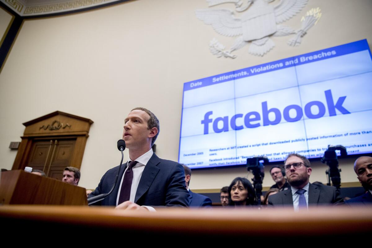 Facebook CEO Mark Zuckerberg testifies at a House Financial Services Committee hearing on Capitol Hill in Washington.