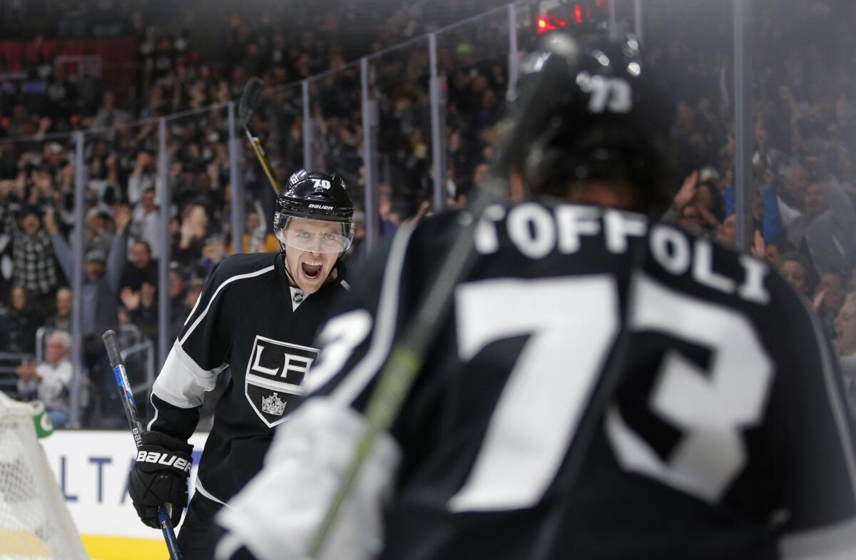 Kings' Tanner Pearson, left, celebrates a goal by Tyler Toffoli (73) during the second period of a game against the Sharks on Dec. 22, 2015.