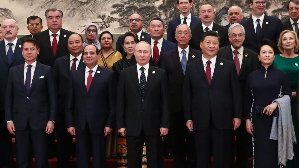 Chinese President Xi Jinping, front center right, and Russian President Vladimir Putin, front center, join other dignitaries at a welcoming banquet April 26 for the Belt and Road Forum at the Great Hall of the People in Beijing.