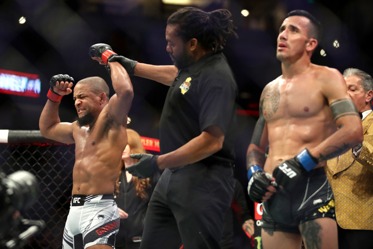 Tony Gravely celebrates after defeating Saimon Oliveira in their bantamweight fight at UFC 270.