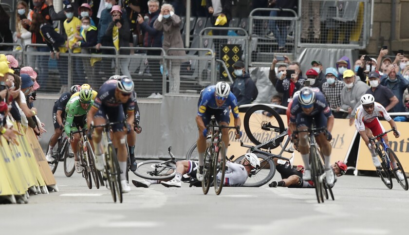Slovakia's Peter Sagan, left, crashes with Australia's Caleb Ewan, right, during the sprint towards the finish line of the third stage of the Tour de France cycling race over 182.9 kilometers (113.65 miles) with start in Lorient and finish in Pontivy, France, Monday, June 28, 2021. (Benoit Tessier/Pool Photo via AP)