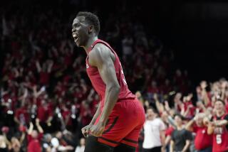 Rutgers' Mawot Mag (3) celebrates after scoring three points to extend their lead over Ohio State in overtime of an NCAA college basketball game, Sunday, Jan. 15, 2023, in Piscataway, N.J. (AP Photo/John Minchillo)