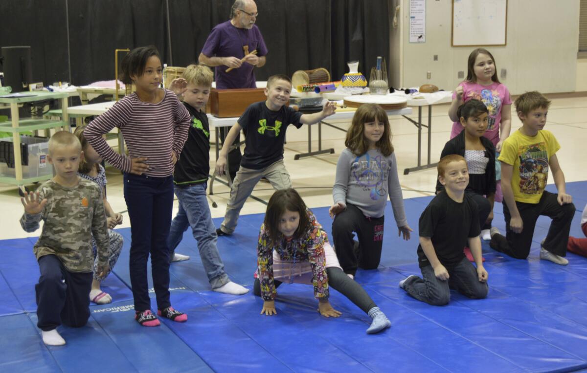 Third grade students at West Homer Elementary School in Homer, Alaska act out an interpretive dance to the sound of a storyteller and percussion on Nov. 13.