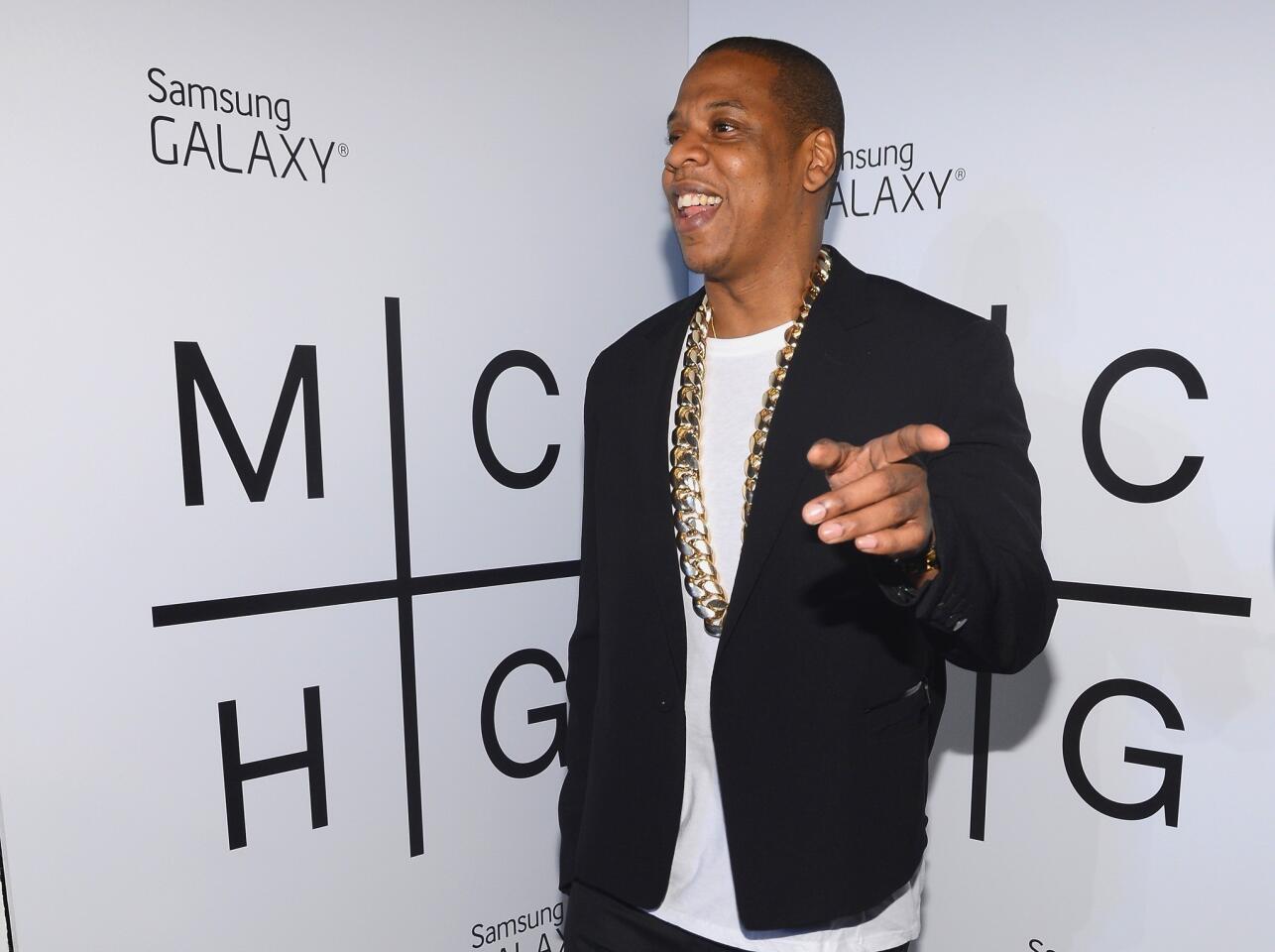 Rapper/businessman/new dad Jay-Z released his 12th solo studio album Wednesday . Produced by Timbaland, "Magna Carta Holy Grail" features cameos from Frank Ocean and Justin Timberlake, Biggie Smalls' grunt and quotes from Nirvana. Times Pop Music critic wrote that while the "sonically stunning" album certainly shimmers, "a true masterpiece harnesses intellect and adventure to push forward not only musically but also thematically."