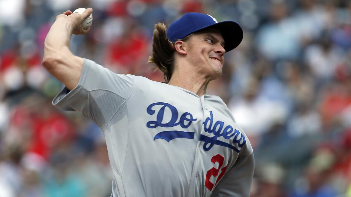 Dodgers starter Zack Greinke delivers a pitch during the third inning against the Washington Nationals on Sunday.