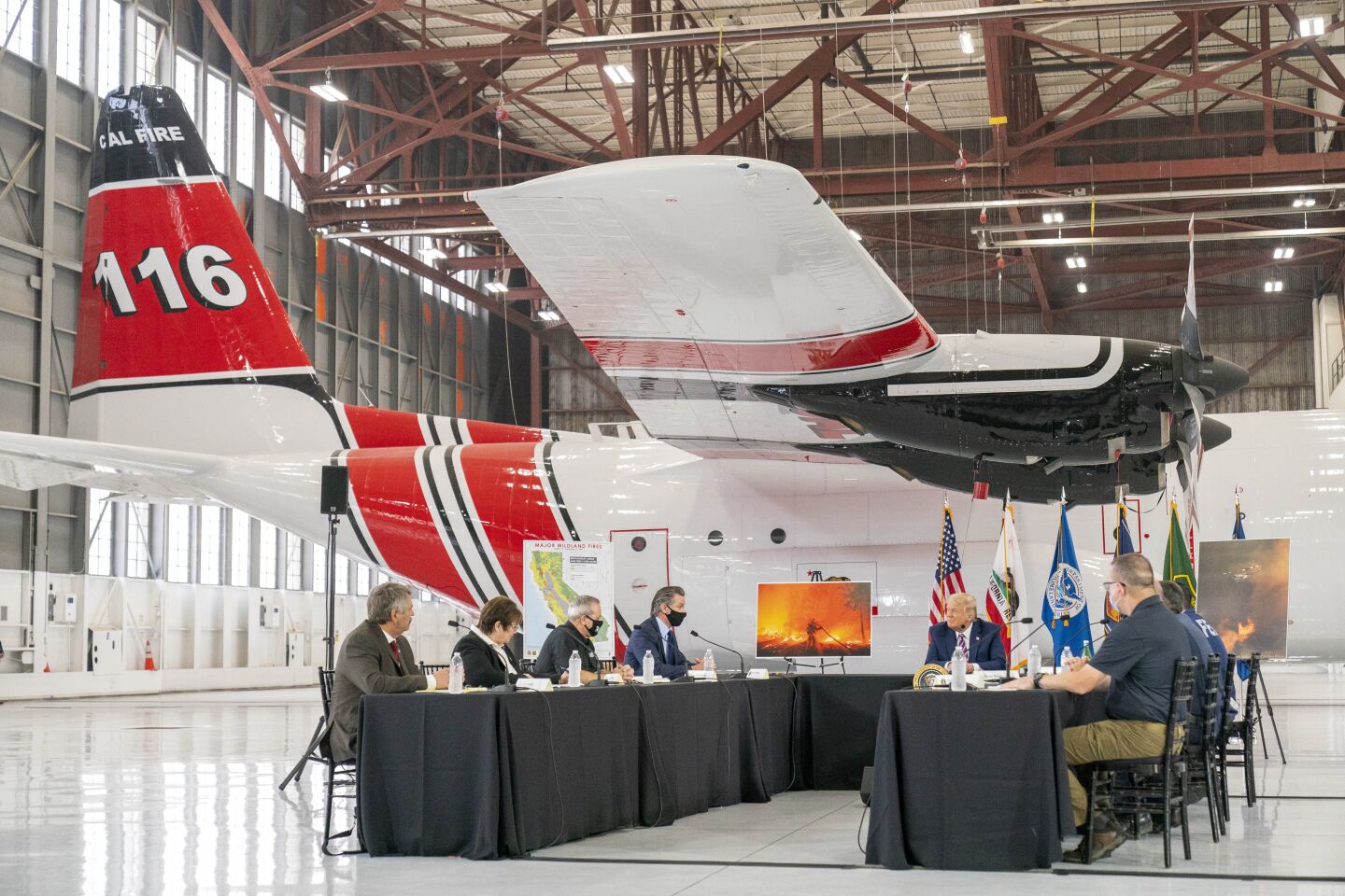 President Trump participates in a news briefing on wildfires in Sacramento.