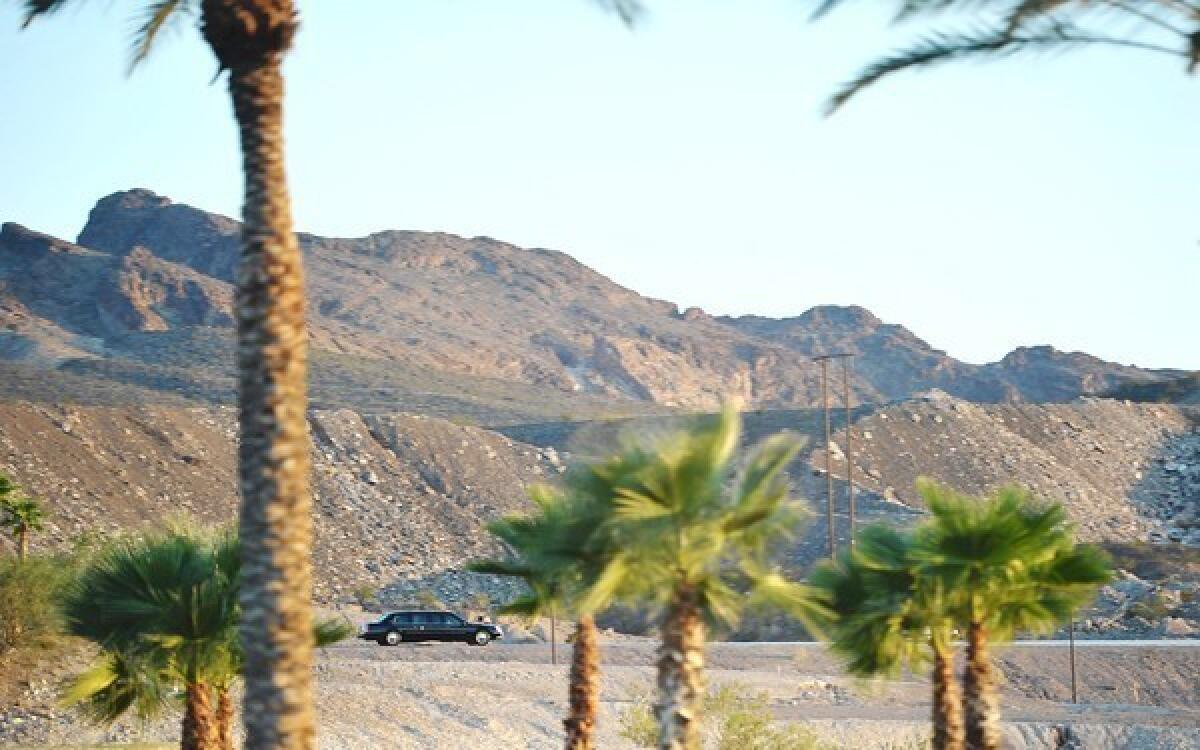 President Obama's limousine pulls away from a hotel where he is holding debate practice at Lake Las Vegas, a tony resort battered by the recession but cautiously optimistic about a comeback.