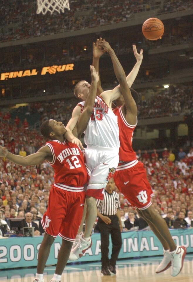 Maryland's Steve Blake, center, is sandwiched by Indiana's Donald Perry, left, and Jeff Newton, right, in the first half.