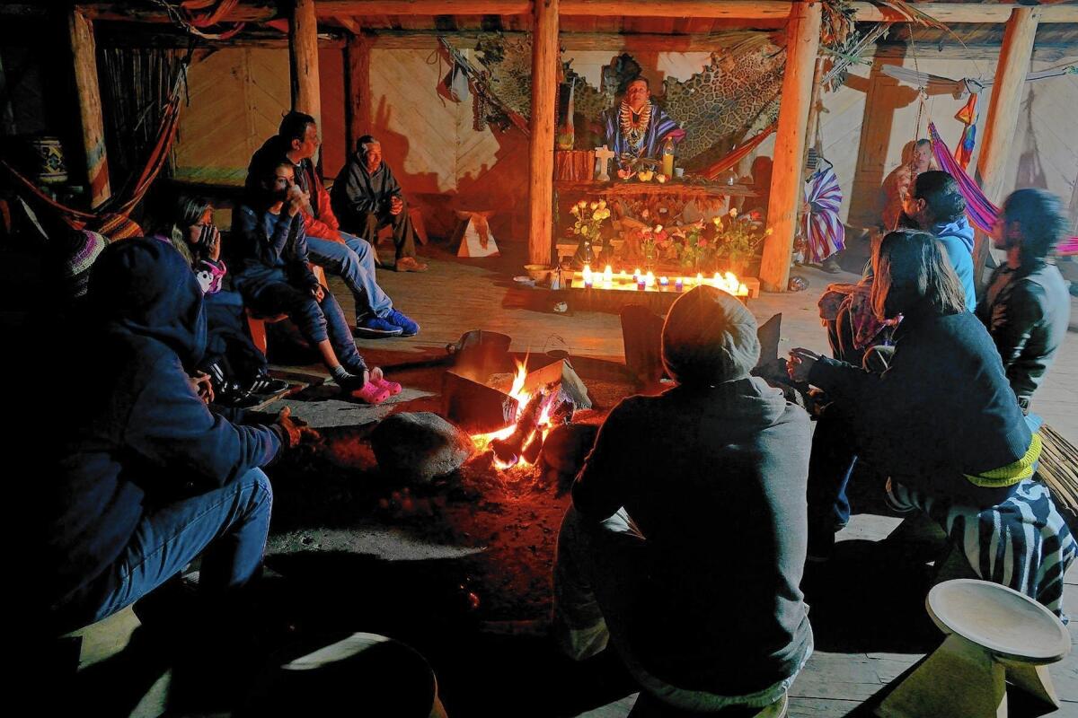 Shaman Juan Mutumbajoy addresses his visitors at a ceremony in Sibundoy, Colombia. He is about to administer yage, a concoction made from Amazonian vines that is also a hallucinatory drug.