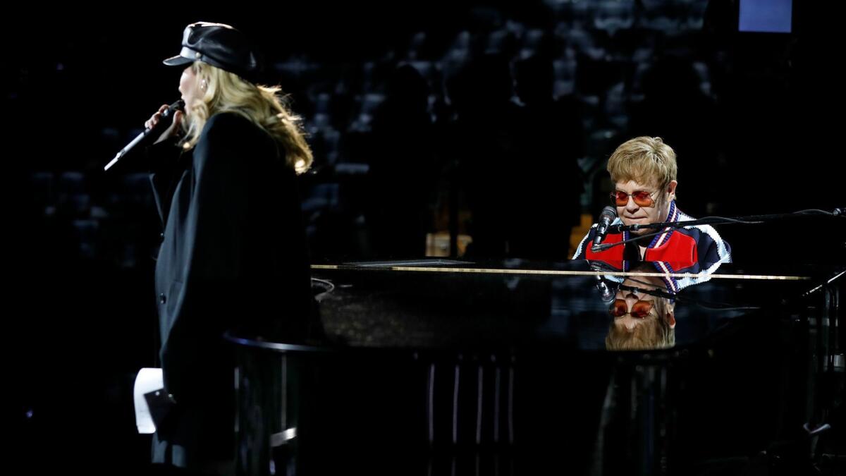 Elton John rehearses with Miley Cyrus for the 60th Grammy Awards show at Madison Square Garden in New York on Jan. 25.