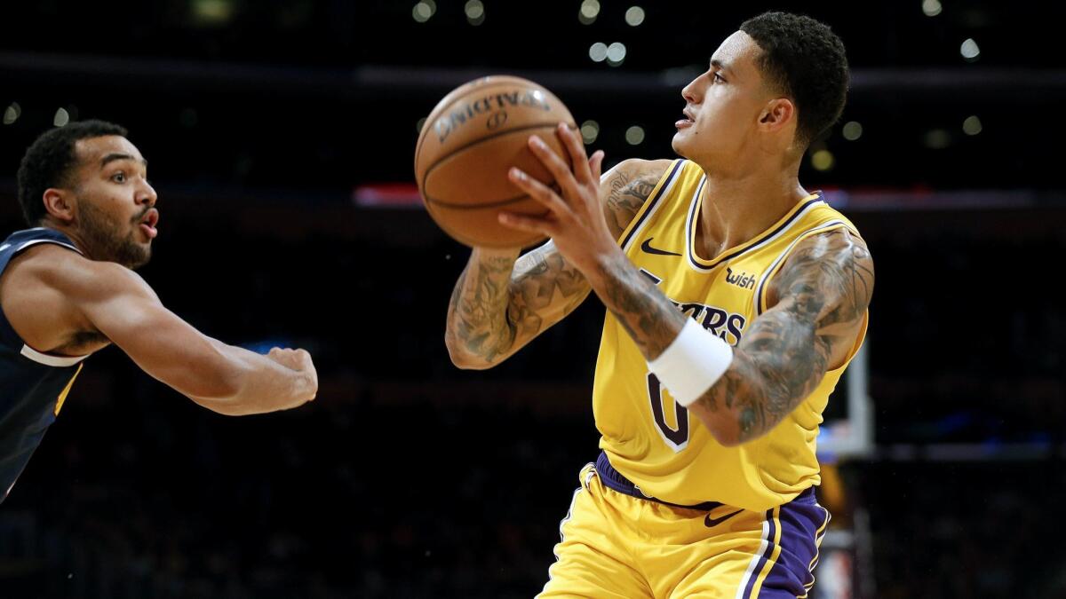 Kyle Kuzma prepares to take a shot against the Nuggets during a game last season.