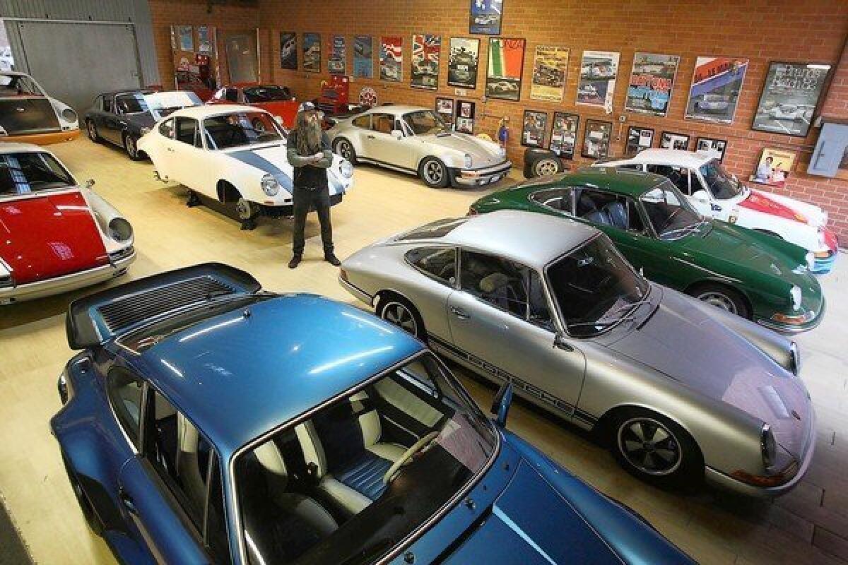 Magnus Walker with some of his vintage Porches inside his warehouse on the fringes of downtown Los Angeles' arts district in November. For more than a decade, Walker has put his custom touches on vintage Porsche 911s.