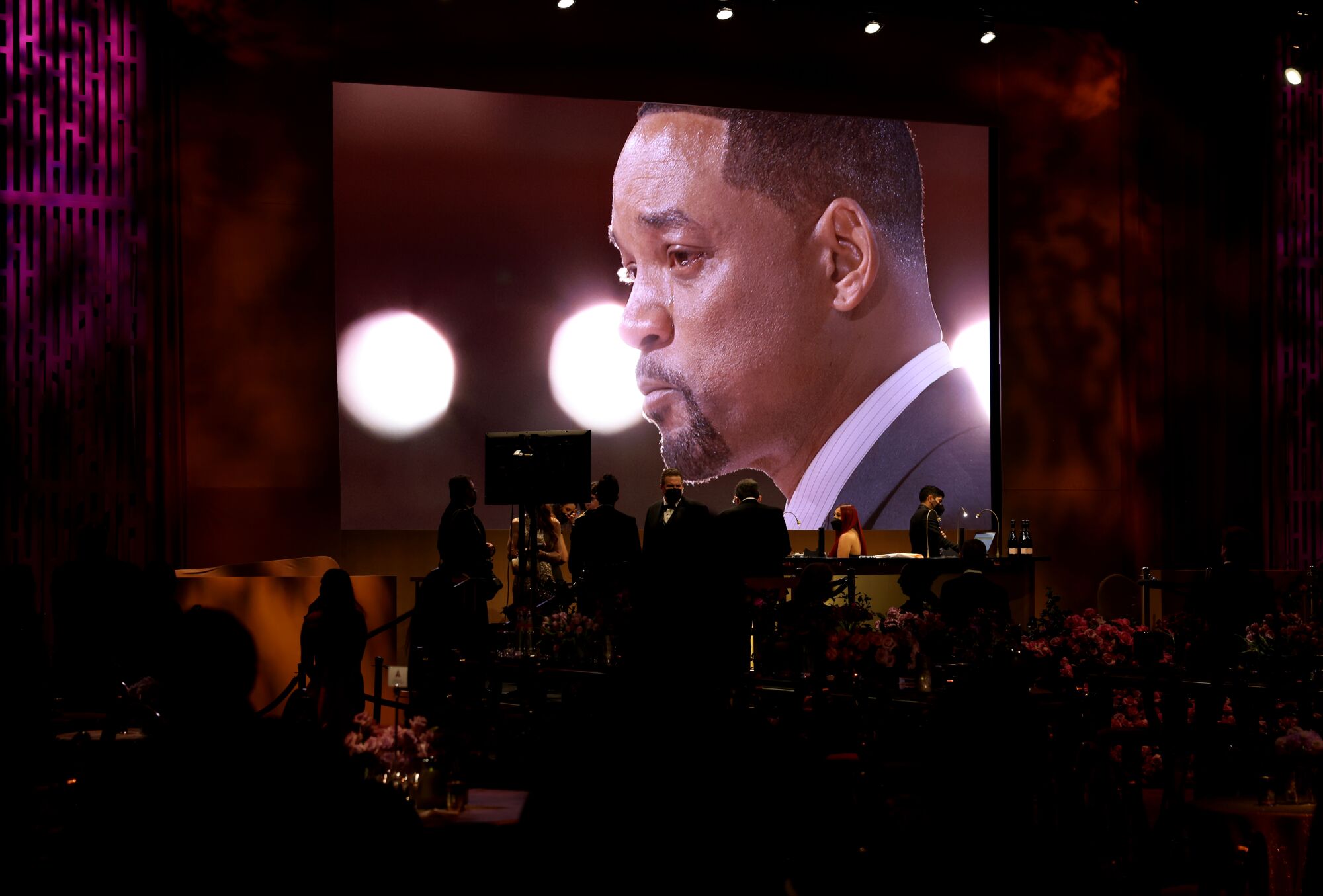 Will Smith on the monitor during the Governors Ball at the 94th Academy Awards at the Dolby Theatre.