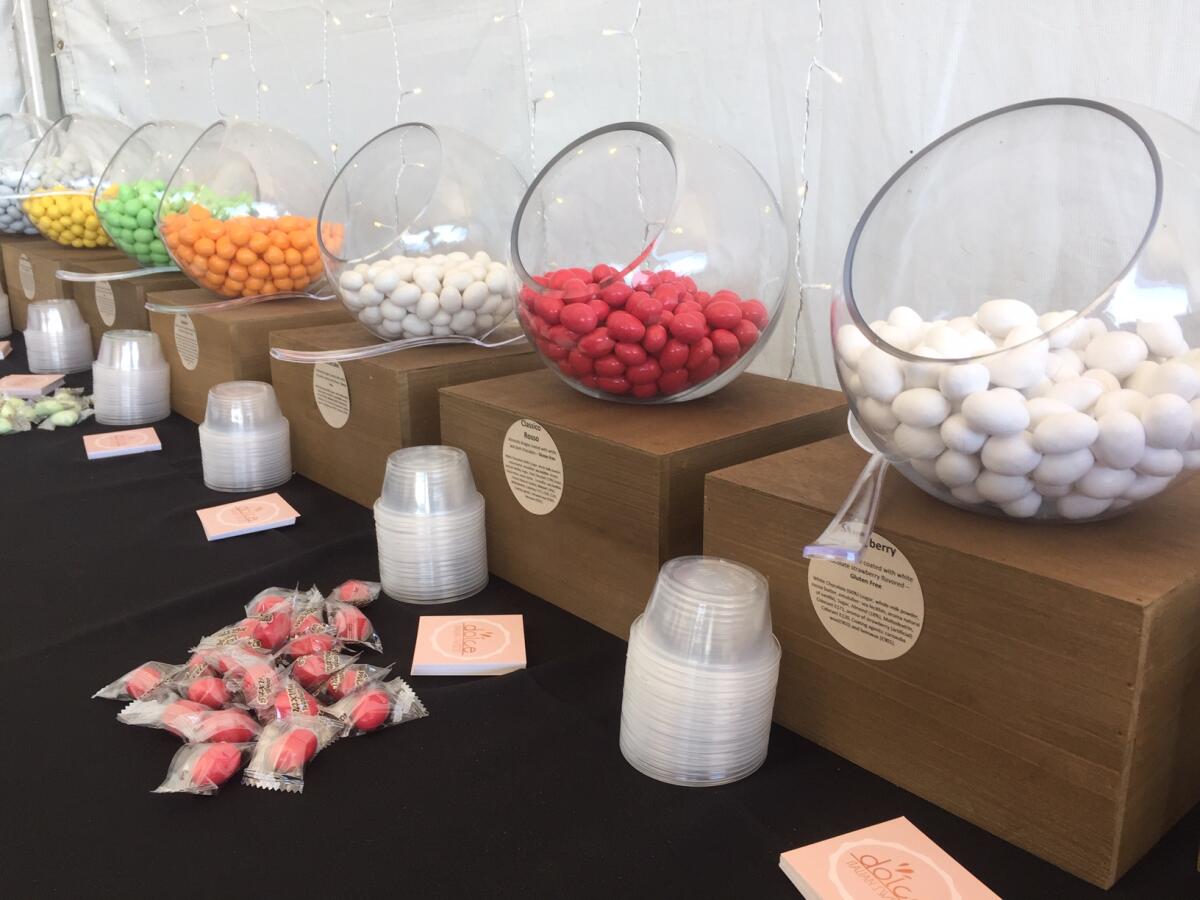 Dolce Italian Sweets recently hosted a sampling table of its imported chocolates at the Super Girl Surf Pro contest in Oceanside. Among the flavors pictured are strawberry, rosewater, pistachio, lemon and orange.