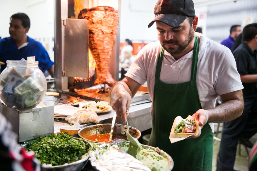 The grillmasters at the Taquería Franc in Tijuana serve up fresh-roasted tacos de adobada -- spit-grilled pork tacos marinated with red chili. The sort of divine dish a coupla of arts journalists need to survive.