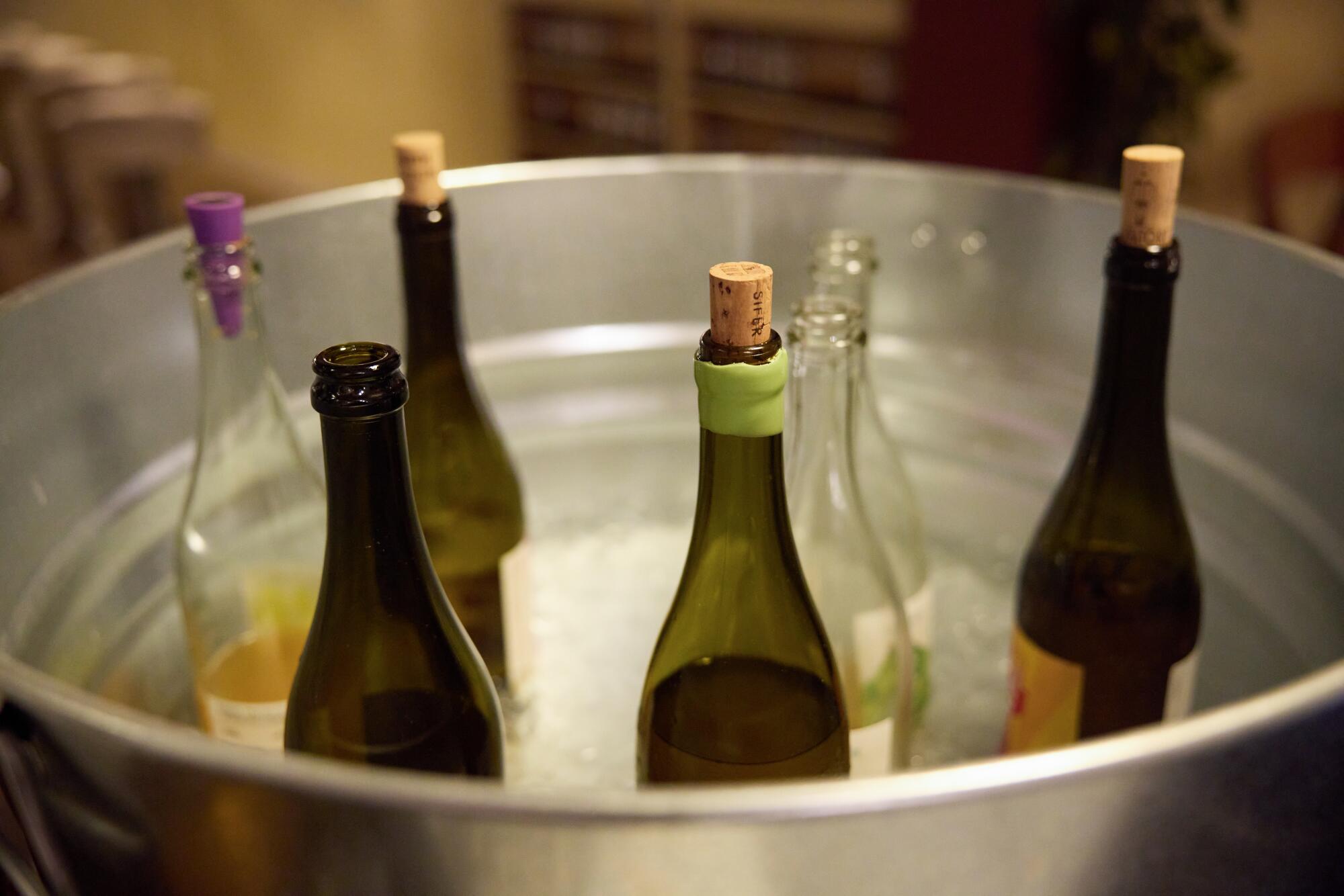 Wine bottles chill in a tub of ice for the dinner service at Bub and Grandma's. 