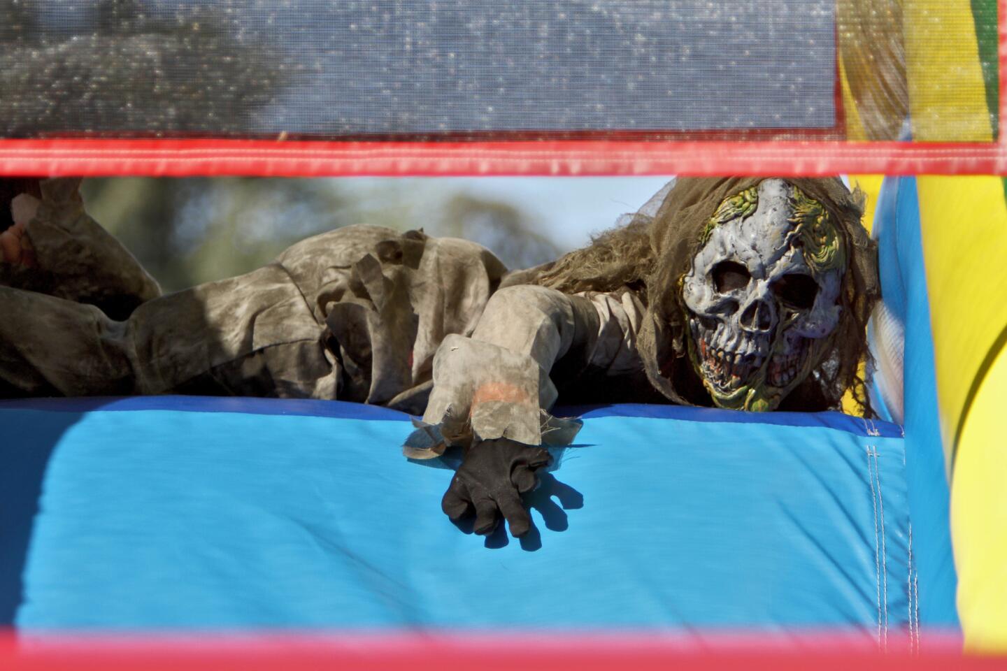 Connor Foley, 5, of La Ca–ada Flintridge, crawls over an obstacle course at the La Ca–ada Elementary School's annual Halloween Haunt, on campus in La Ca–ada Flintridge on Saturday, October 22, 2016.