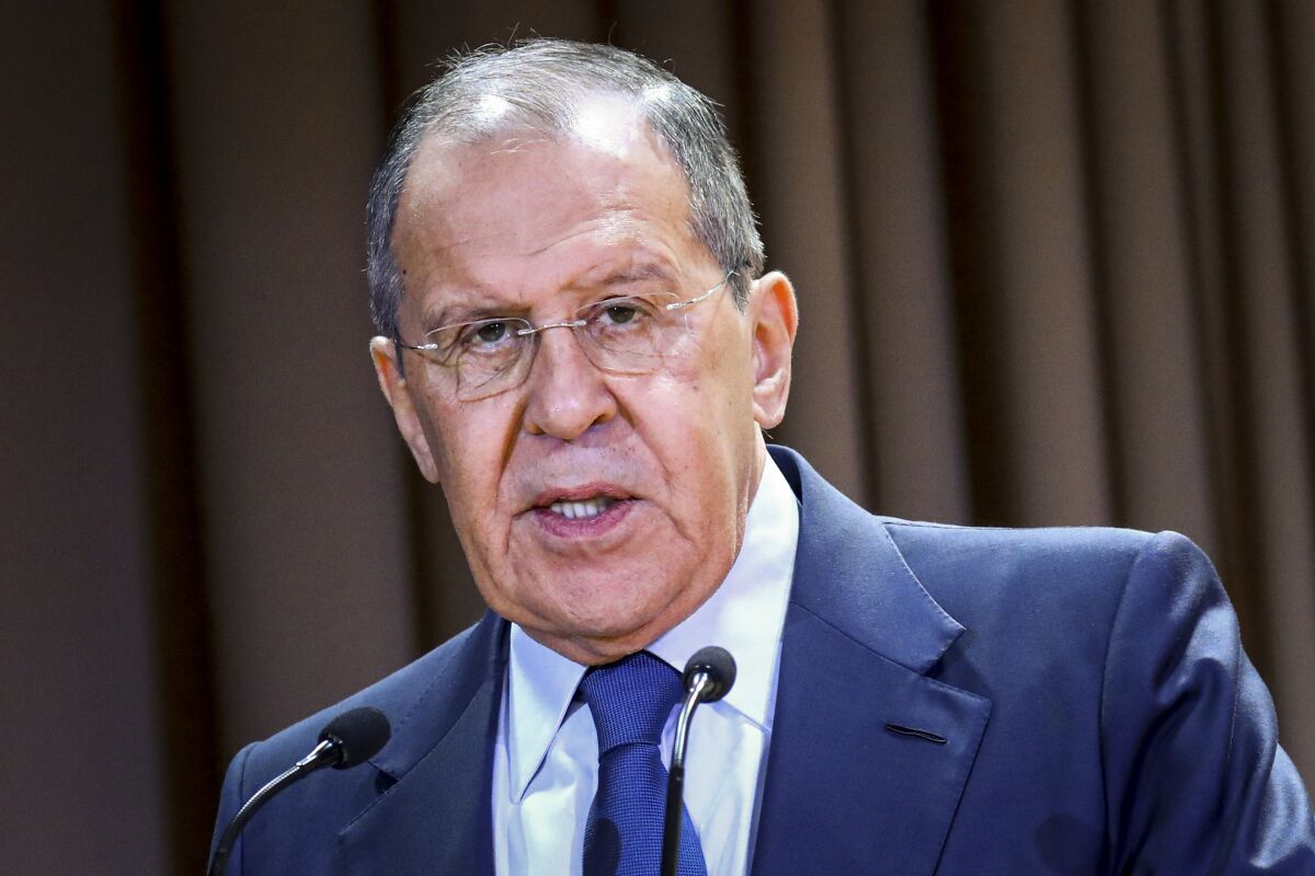 In this handout photo released by the Russian Foreign Ministry Press Service, Russian Foreign Minister Sergey Lavrov speaks on the side of the meeting dedicated to the 25th anniversary of the House of Russian Diaspora named after Alexander Solzhenitsyn in Moscow, Russia, Monday, Oct. 18, 2021. Russia’s foreign minister says that the country is suspending its mission to NATO. Lavrov said Monday that the move is in response to last week’s expulsion by NATO of eight members of Russia’s mission to the military alliance. NATO said that they were secretly working as intelligence officers and halved the size of Moscow’s team able to work at its headquarters. Lavrov also announced that NATO’s military liaison and information offices in Moscow would be closed.(Russian Foreign Ministry Press Service via AP)