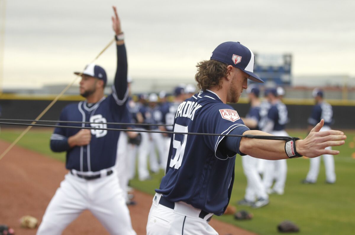 Padres pitchers Chris Paddack, and and Joey Lucchesi warmup on the first official day of Padres spring training for pitchers and catchers at the Peoria Sports Complex in Peoria, Arizona on Thursday, Feb. 14, 2019.