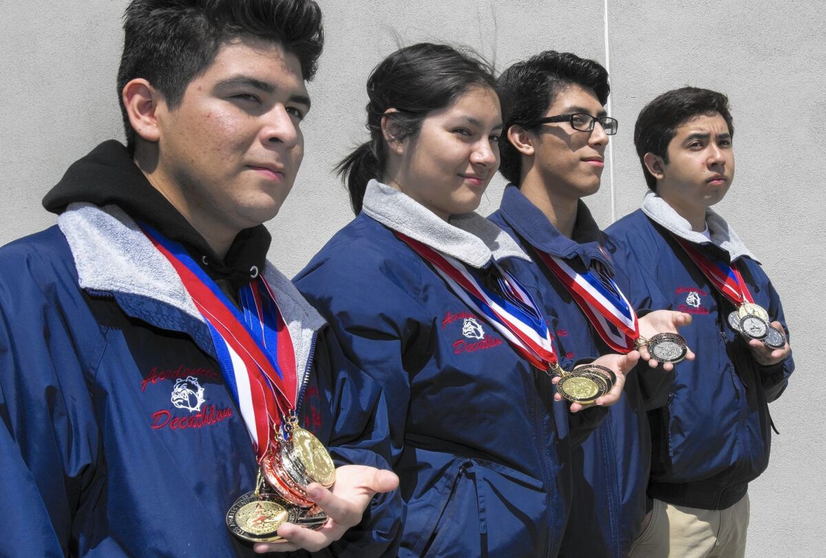 Garfield High School students Joey Nabor, left to right, Wendy Olvera, Alfonso Caballero and Brian Rios are competing in the national academic decathlon.