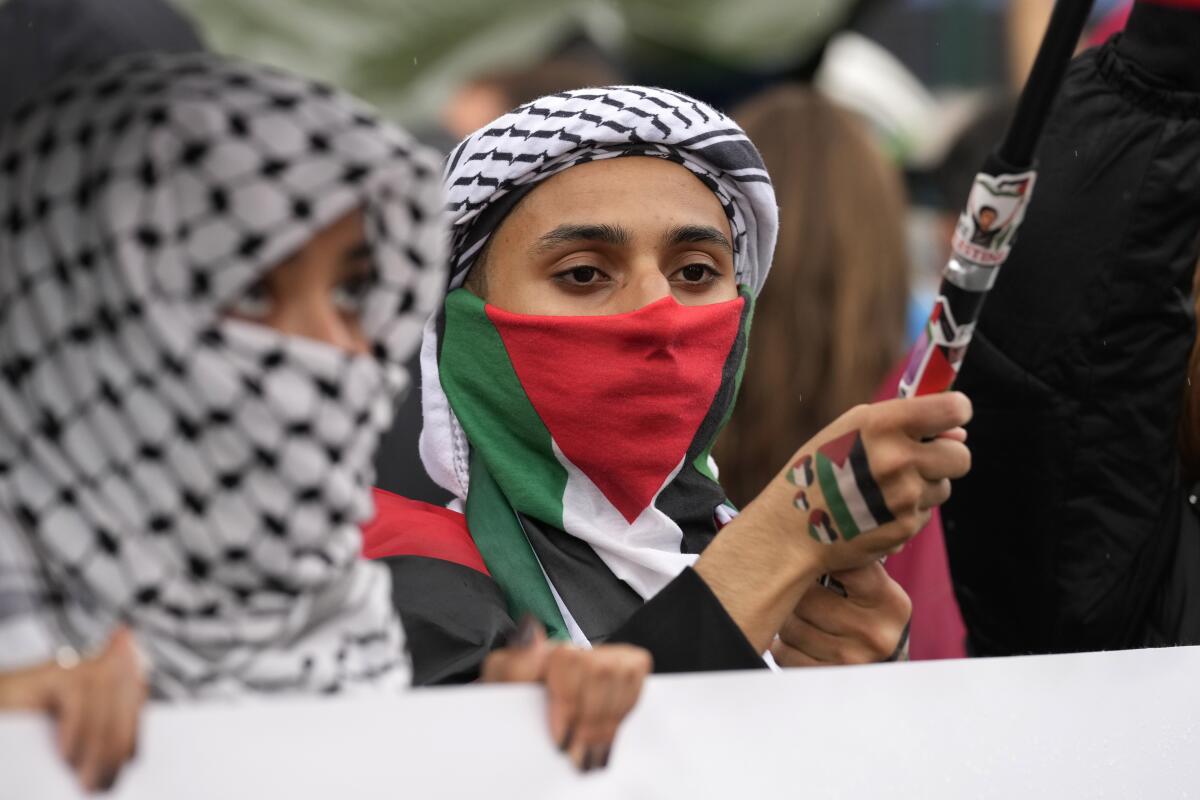 Women attend at a protest in Rome