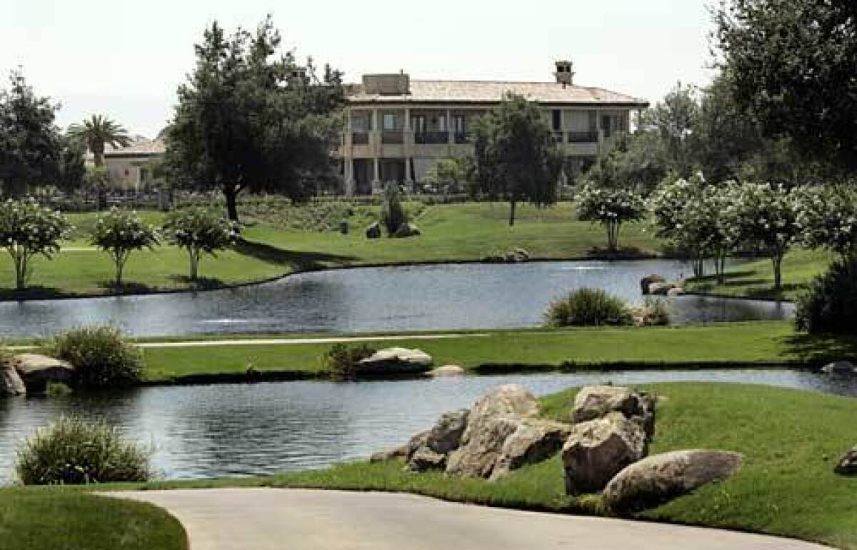 Million-dollar homes overlook the country club golf course in the southwest Bakersfield area of Seven Oaks.