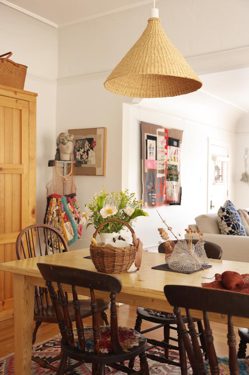 A table and dining walls lined with art