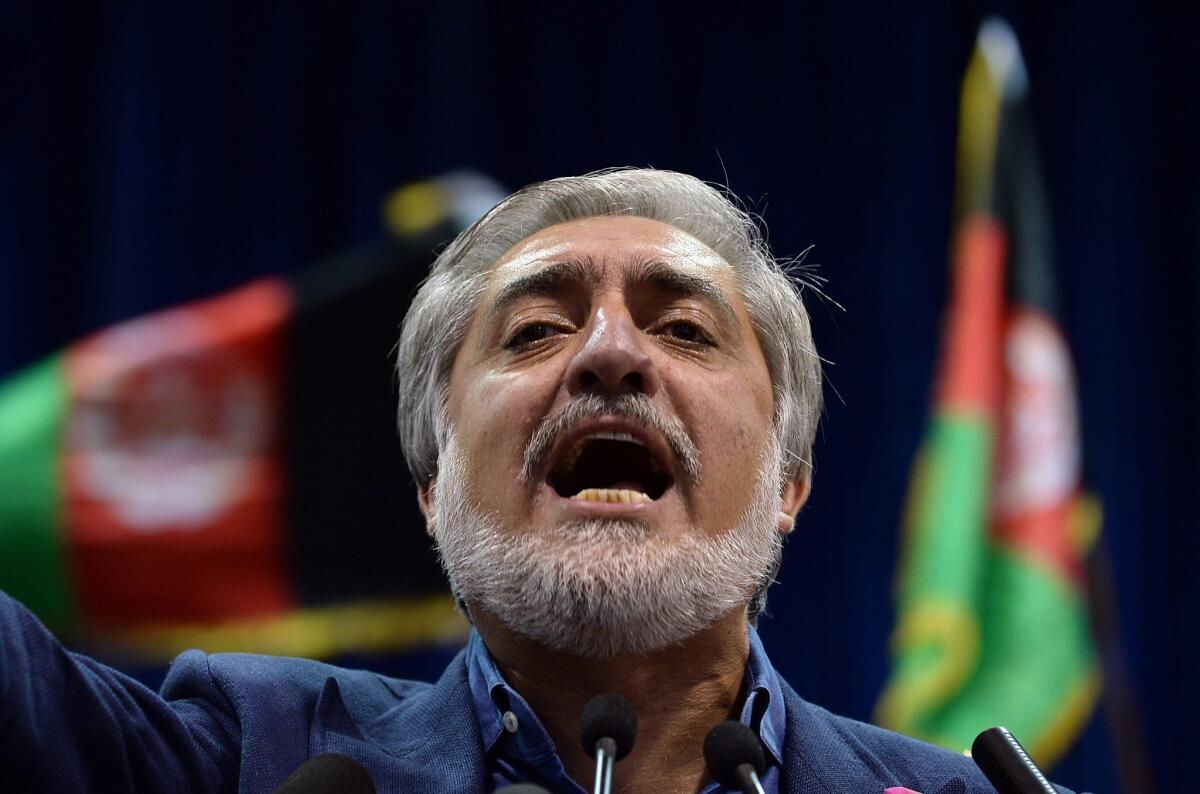 Afghan presidential candidate Abdullah Abdullah speaks at a rally in Kabul on July 8.