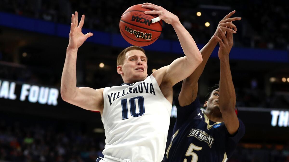Villanova guard Donte DiVincenzo grabs a rebound during a game against Mount St. Mary's last season.