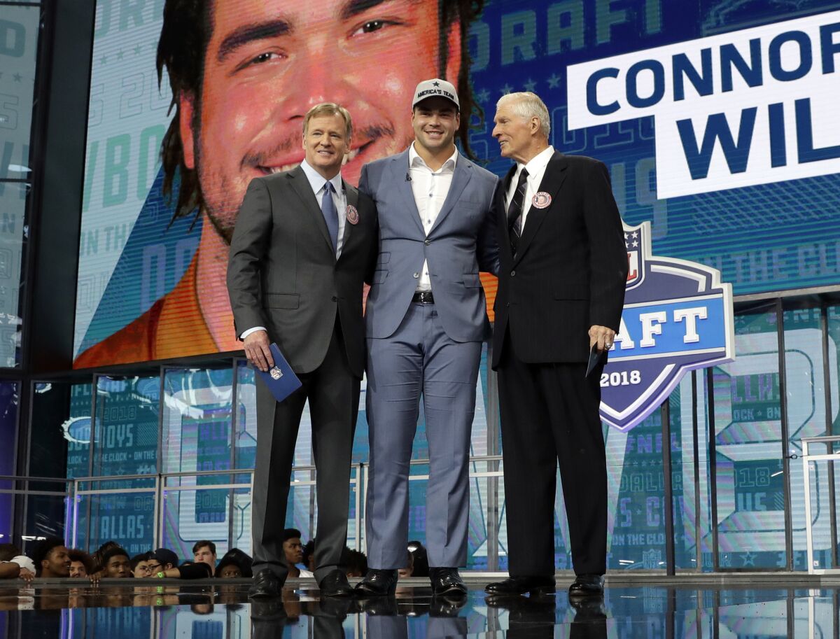 NFL Commissioner Roger Goodell, left, and former Dallas Cowboys Bob Lilly, right, pose with Connor Williams.