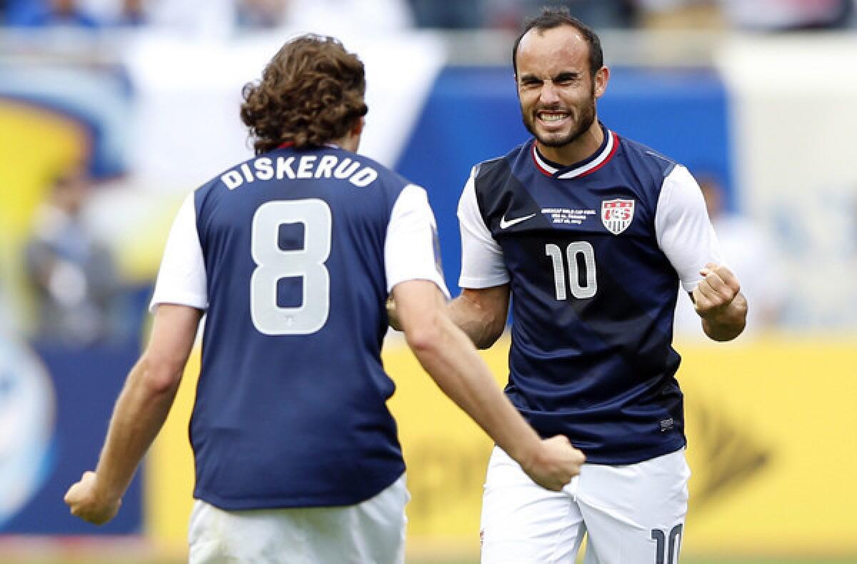 Landon Donovan and Mikkel Diskerud celebrate after a victory over Panama in the Gold Cup.