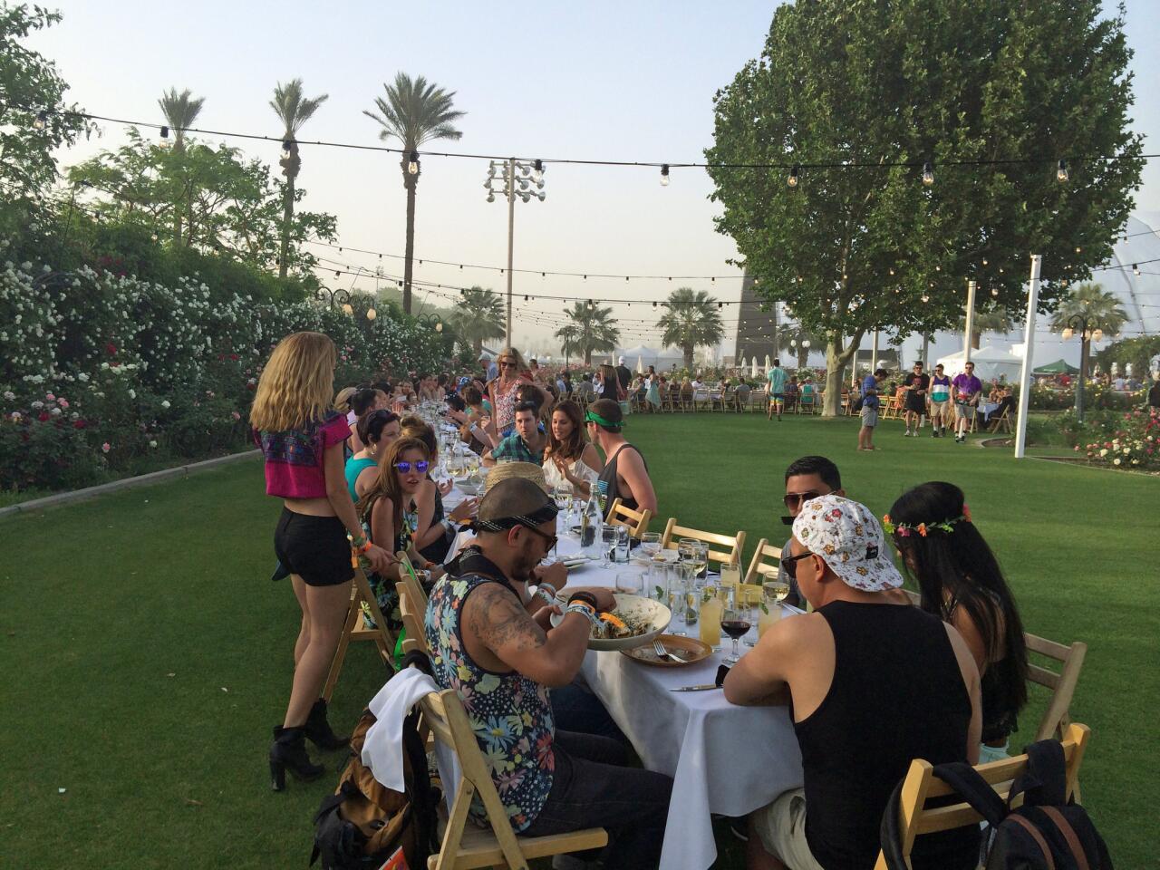 Guests sit down to the Outstanding in the Field dinner during the first weekend of the Coachella Valley Music and Arts Festival.