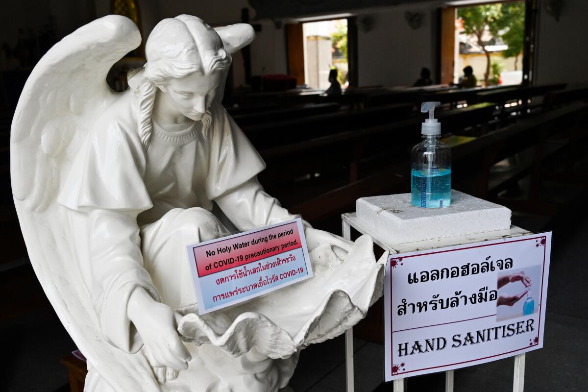 Hand sanitizer is installed the Good Friday service at a church in Bangkok on April 10, 2020.