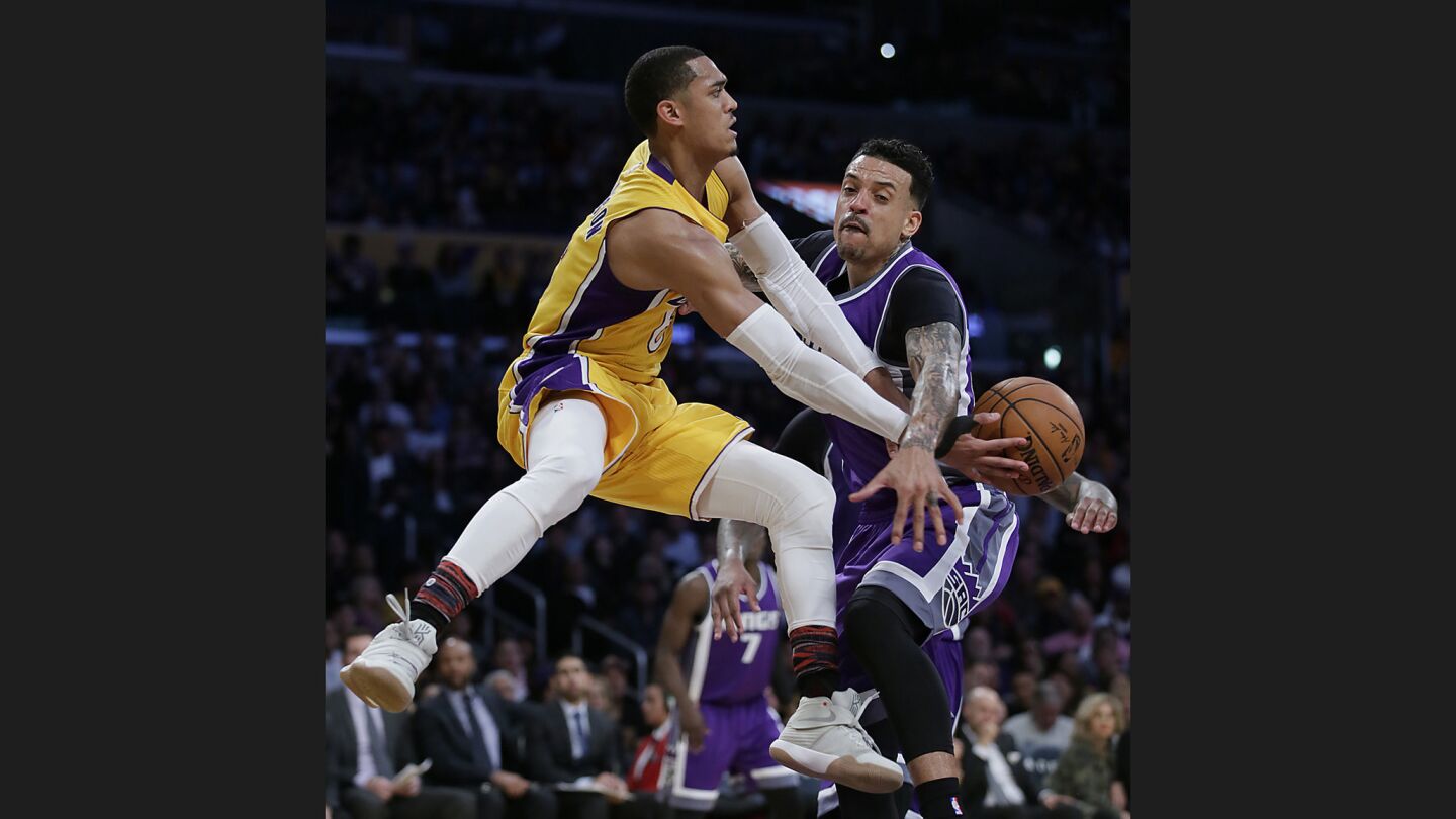 Lakers guard Jordan Clarkson slips a pass past Kings guard Matt Barnes during the second halfof a game on Feb. 14 at Staples Center.