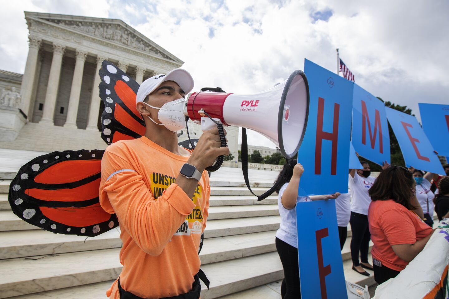 Deferred Action for Childhood Arrivals recipient Roberto Martinez celebrates in front of the Supreme Court.