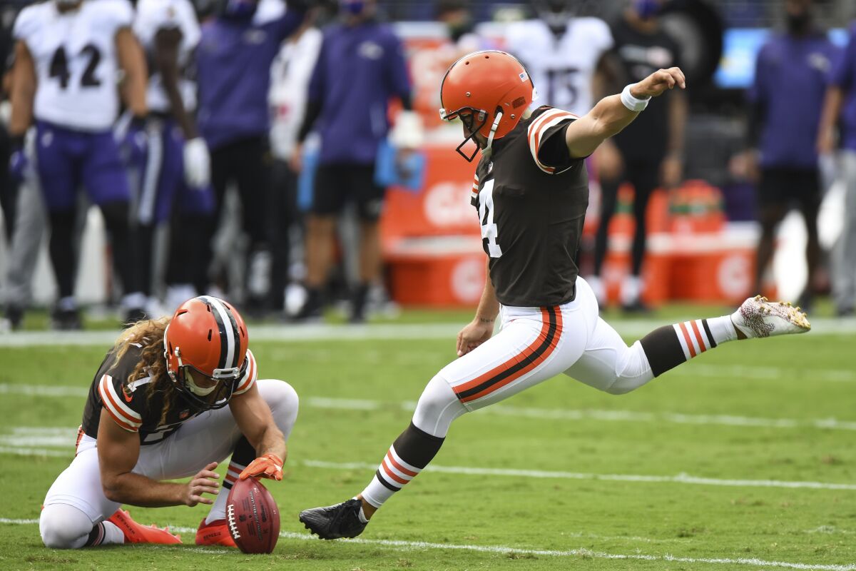 Cleveland Browns place kicker Austin Seibert (4) attempts an extra point in the first half during an NFL football game against the Baltimore Ravens, Sunday, Sept. 13, 2020, in Baltimore. The Browns are replacing kicker Austin Seibert after he missed an extra point and field goal in Sunday's opener, a person familiar with the decision told the Associated Press. Seibert, who clanged his extra point off the left upright and pushed a 41-yard field-goal try to the right, will be replaced by Cody Parkey, said the person who spoke on condition of anonymity because the team has not made the move official. (AP Photo/Terrance Williams, File)