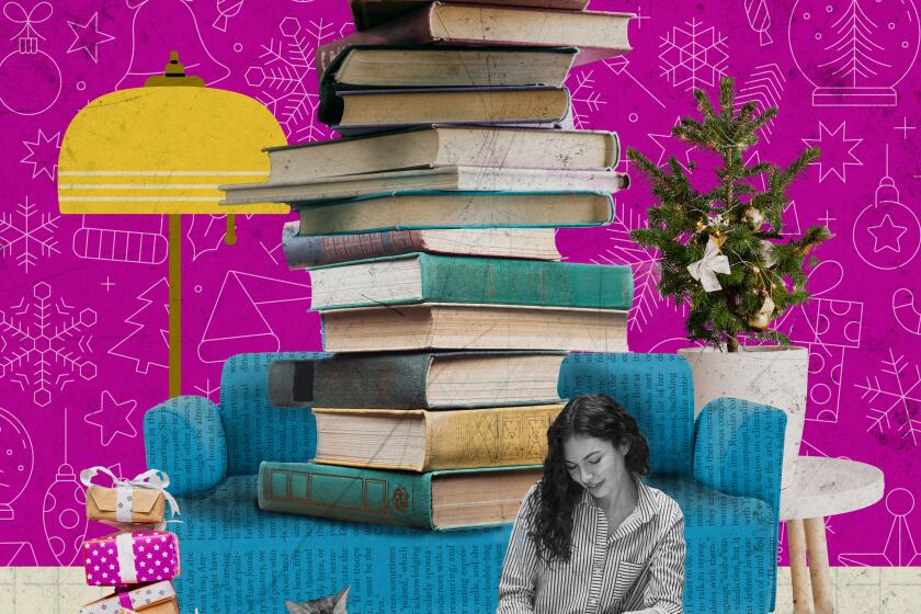 A woman sits on the floor reading with a stack of books behind her.