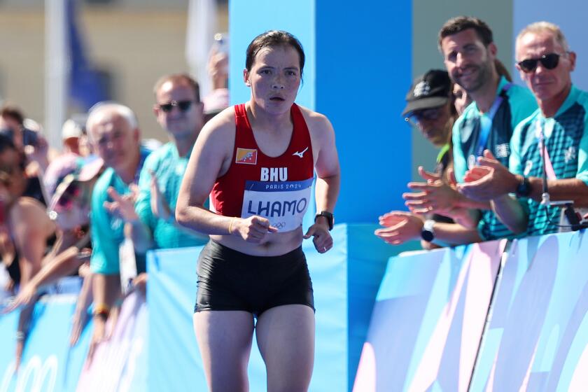 PARIS, FRANCE - AUGUST 11: Kinzang Lhamo of Team Bhutan competes during the Women's Marathon.