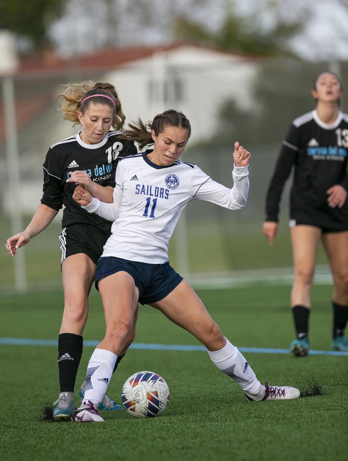 Newport Harbor's Isabelle Whittaker battles for a ball against CdM's Helena Litvak during Thursday's match.