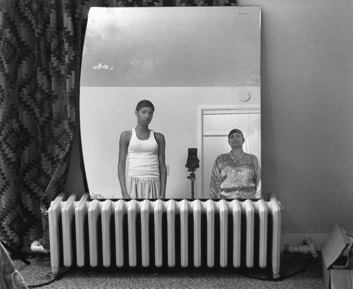 For years, photographer LaToya Ruby Frazier, left, has been chronicling working-class life in the steel mill town of Braddock, Pa. Here she poses with her mother in "Mom Making an Image of Me," from 2008.