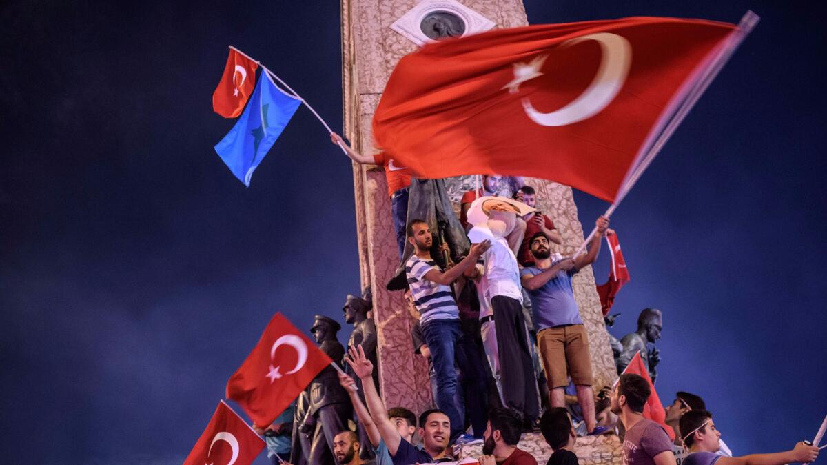 Supporters of Turkish President Recep Tayyip Erdogan hold an effigy of Fethullah Gulen during a rally at Taksim Square in Istanbul in July. They blamed the coup on Gulen's followers.
